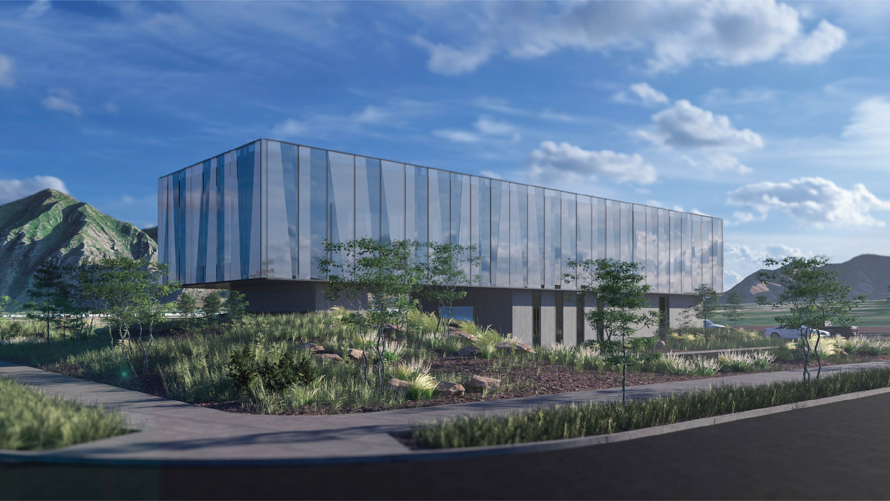 a building with glass walls and a garden