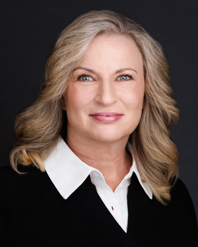 a woman with blonde hair and a black shirt