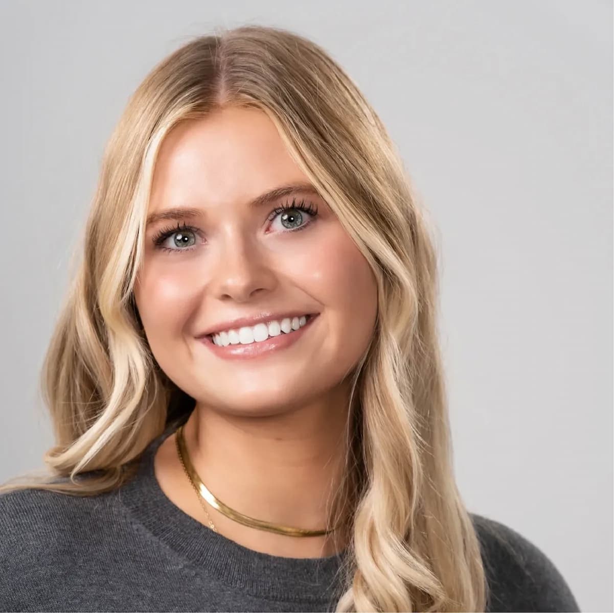 a woman smiling at camera