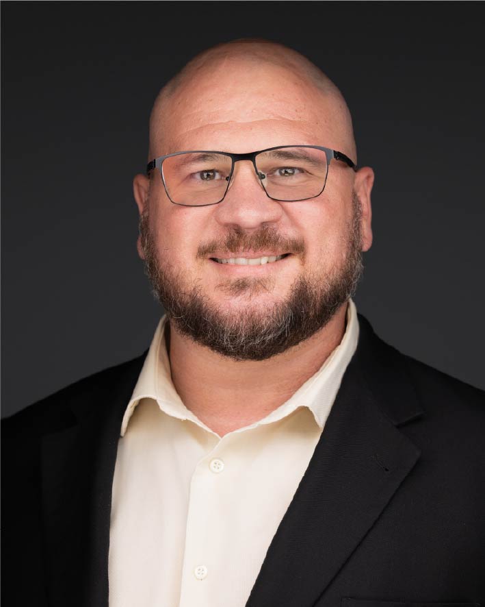 a man in a suit and glasses