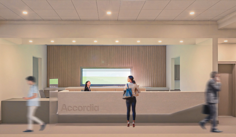 a woman standing in front of a reception desk