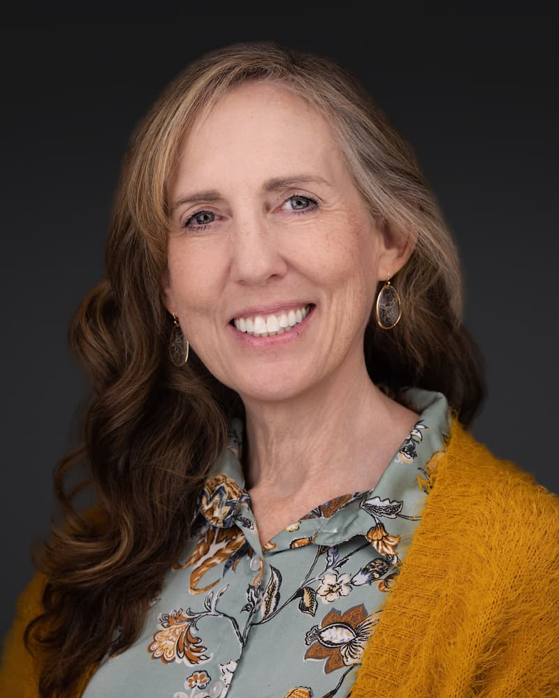 a woman smiling at camera