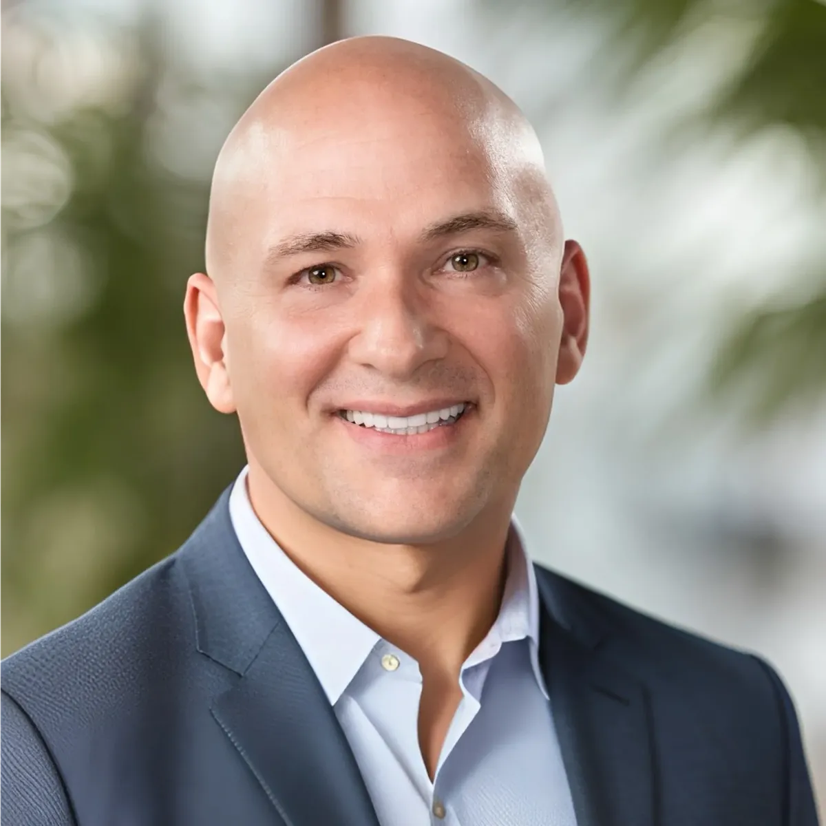 a man in a suit smiling